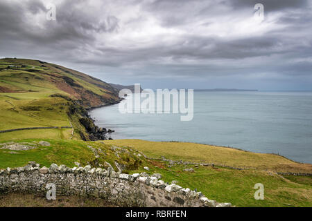This is a picture of the coastline looking back to Fair Head cliffs from Torr Head on the Antrim Coast in Ireland Stock Photo