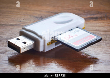 BUENOS AIRES, ARGENTINA - JANUARY 9, 2019: Closeup of USB flash drive with adapters and an SD memory inserted. Stock Photo