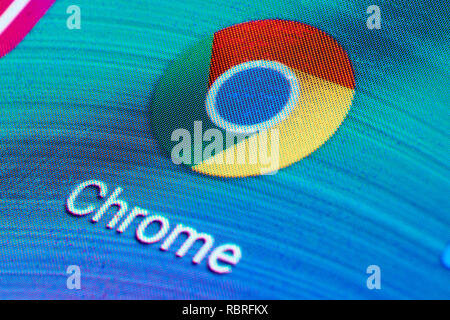 Google Chrome application icon on mobile phone touch screen (Android device). Macro shot. Stock Photo