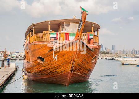 Abu Dhabi, United Arab Emirates, December 16, 2015: Traditional dhow, moored in the marina. This one takes tourists sightseeing. Stock Photo