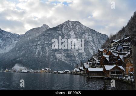 Hallstatt, Austria in winter. View from the lake to Hallstatt and the snowy mountains at the background. Stock Photo