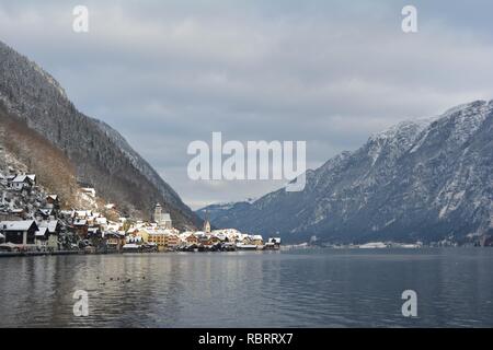 Hallstatt, Austria in winter. View from the lake to Hallstatt and the snowy mountains at the background. Stock Photo