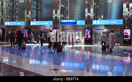 Dubai Airport, UAE - October 8th, 2017: Modern architecture with large lifts and water fountains inside of Dubai airport Stock Photo