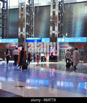 Dubai Airport, UAE - October 8th, 2017: Modern architecture with large lifts and water fountains inside of Dubai airport Stock Photo