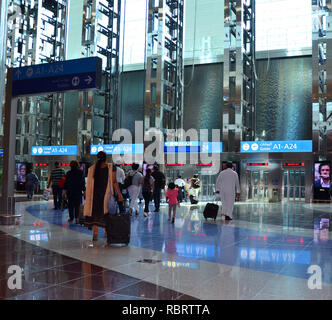 Dubai Airport, UAE - October 8th, 2017: Modern architecture with large lifts and water fountains inside of Dubai airport Stock Photo