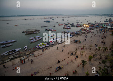 Elevated blue hour (post sunset) scene of the Ganges with boats in the river in Varanasi, India Stock Photo