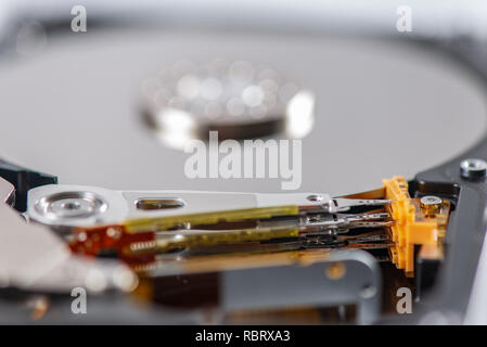 hard disk rotating details. open up computer memory device with reading head and disk Stock Photo