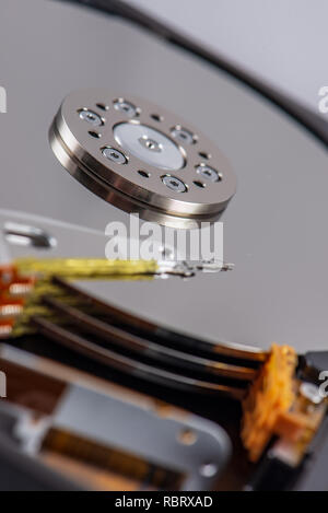 hard disk rotating details. open up computer memory device with reading head and disk Stock Photo