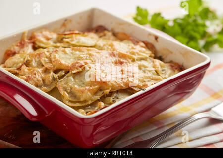 Potatoes a la dauphinoise in a baking dish Stock Photo