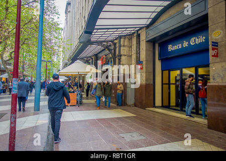 SANTIAGO, CHILE - OCTOBER 16, 2018: Outdoor view of crowd of people walking in the sidewalk in Santiago, Chile Stock Photo