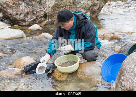 Adventures on the river. Modern alluvial gold prospector Stock Photo