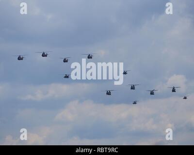 A lot of Royal Netherlands Air force helicopters in the air. Stock Photo