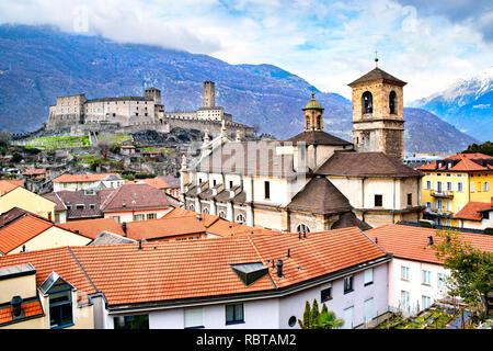 Beautiful ancient city of Bellinzona in Switzerland with  Collegiata dei Ss. Pietro e Stefano church and Castelgrande castle on background Stock Photo