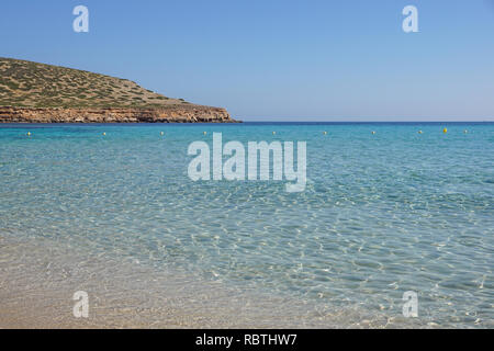 Beautiful sandy Cala Comte beach with azure blue sea water, Ibiza island, Spain Stock Photo