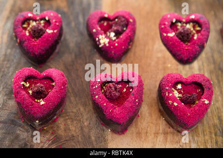 Six heart shaped Valentines day pink and red raspberry cookies Stock Photo