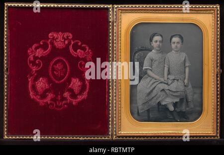 -Two Girls in Identical Dresses- Stock Photo