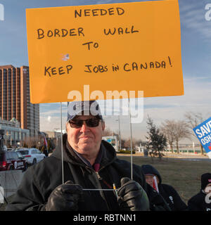 Windsor, Ontario, Canada - 11 January 2019 - Canadian auto workers, members of the Unifor labor union, rallied across the Detroit River from the General Motors headquarters in Detroit to protest GM's plan to close the Oshawa, Ontario assembly plant, throwing thousands out of work. Credit: Jim West/Alamy Live News Stock Photo