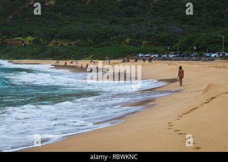 Oahu beach with big waves and many people on sand Stock Photo