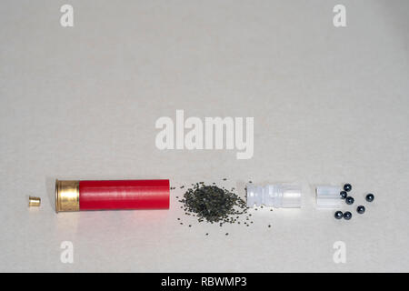 Casings, gunpowder, shot capsules on light background Stock Photo