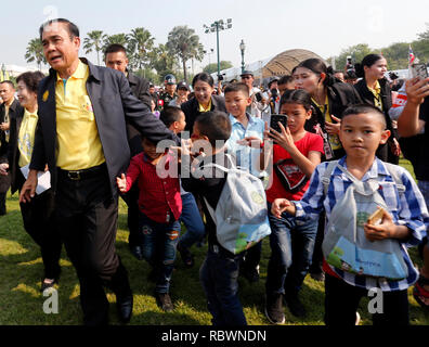 Bangkok, Thailand. 12th Jan, 2019. Thailand's Prime Minister Prayuth Chan-ocha walks with children during the Children's Day celebration at Government House in Bangkok, Thailand, on January 14, 2017. Credit: Chaiwat Subprasom/Pacific Press/Alamy Live News Stock Photo