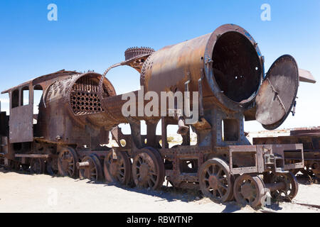 The train cemetary outside Uyuni, Bolivia, contains a huge number of abandoned locomotives making a unique sculptural feature in the desert. Stock Photo