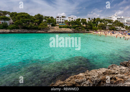 Crowded beach Cala Gran in Cala d'Or, Mallorca during summer season Stock Photo