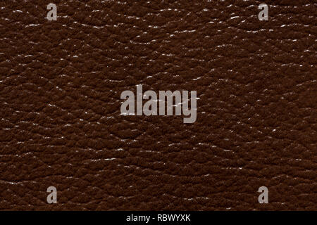 Saturated brown expensive leather texture, macro abstract background. Stock Photo