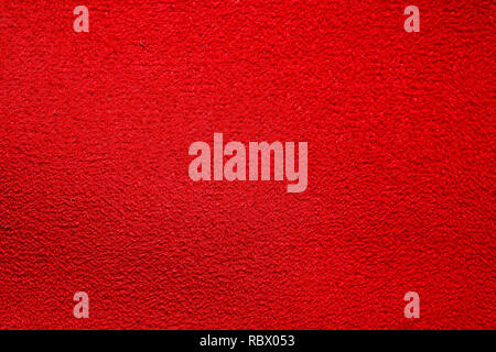 Passionate shiny red tissue background on macro. Stock Photo