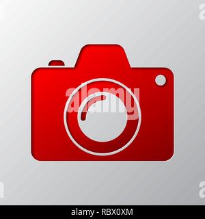 Bright red photo camera out of paper. Vector illustration. Photo Camera is cut from paper. Camera icon with shadow. Stock Vector