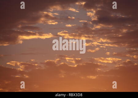 Stratocumulus Cumulogenitus Cloud Cover at Sunset Stock Photo