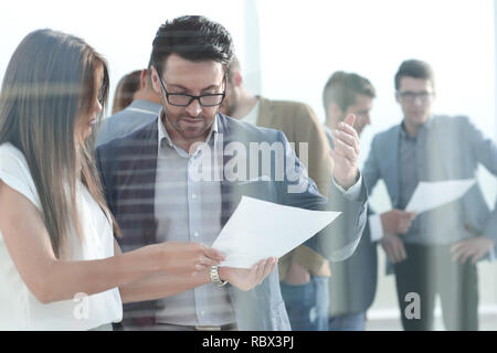 boss and assistant to discuss the work schedule Stock Photo