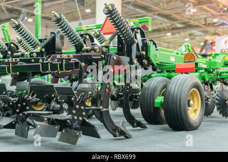 Corn harvester head with several silver blades. Agricultural machinery for soil cultivation Stock Photo