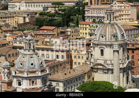 Domes churches of Santa Maria di Loreto and Santissimo Nome di Maria (Most Holy Name of Mary) and roofs of houses in square of Venice,Rome,Italy Stock Photo