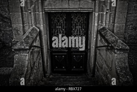 A Scary Underground Door in black and white in Rabat, Malta. Stock Photo