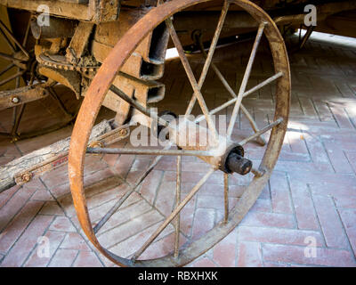 Old metal cart wheel from an old wagon Stock Photo