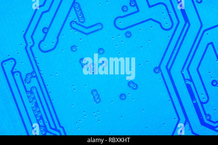 Macro shot of a Circuitboard with resistors microchips and electronic components. Computer hardware technology. Integrated communication processor in  Stock Photo