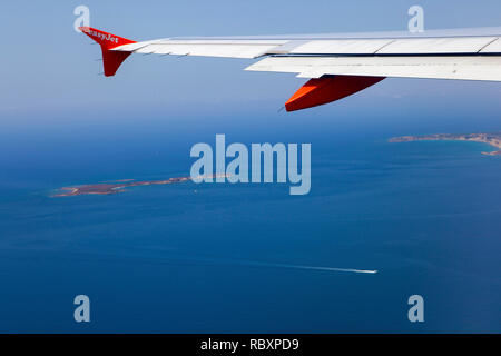 A view out of an Easyjet window, leaving Argostoli airport, Kefalonia looking down onto Vardiani island (or Rabbit Island) Stock Photo