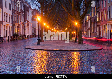 Leiden, The Netherlands, January 7, 2019: lighttrail of a passing bicycle on an otherwise deserted street in the old town center Stock Photo