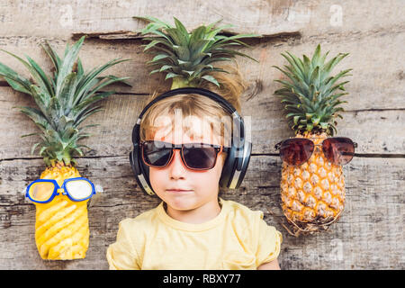 A pineapple boy and pineapples on vacation. Stock Photo