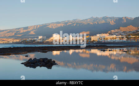 Early morning light over the south-west coast of the island, towards the most popular resorts in Costa Adeje for entertainment, Las Americas, Tenerife Stock Photo