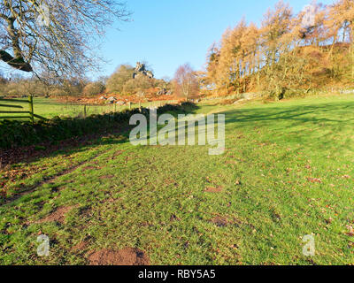 Footpath, beside a stone wall, leading to Robin Hoods Stride in Derbyshire Stock Photo