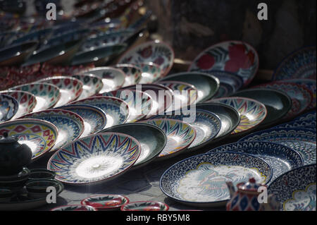 Handmade souvenirs for sale by street vendors in Bukhara, Uzbekistan. Stock Photo