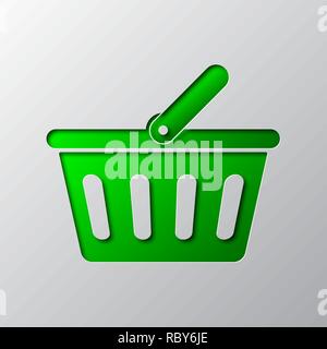 The shopping basket icon is cut from the paper. Vector illustration. Paper art of the green shopping basket icon, isolated. Stock Vector