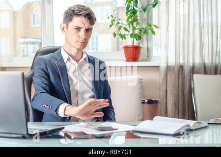 The official businessman sitting at workplace in office refuses bribes. The concept of corruption and bribery Stock Photo