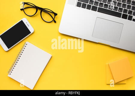 Top view of office desk table with modern accessories,supplies on color background.flat lay design.business concepts ideas