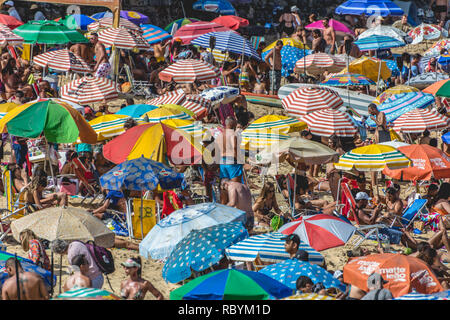 2019, january. Rio de Janeiro, Brazil. Crowded beach full of umbrellas, in Urca. Stock Photo