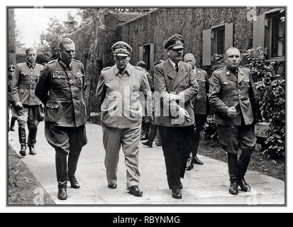 ADOLF HITLER BOMB PLOT ASSASSINATION ATTEMPT  RASTENBURG JULY 20th 1944 Vintage WW2 image of group including Chief of Staff of Supreme High Command of the German Armed Forces, Field Marshal Wilhelm Keitel, Reich Minister of the Imperial Ministry of Aviation Hermann Goering, Adolf Hitler and Head of the Party Chancellery Nazi Party, Hitler’s closest associate is Martin Bormann. The photograph was taken around an hour after the bravest failed attempt on Adolf Hitler’s life – he rubs the arm damaged by the explosion. ‘Wolfs Lair’ Field Headquarters Rastenburg East Prussia Germany July 20, 1944 Stock Photo