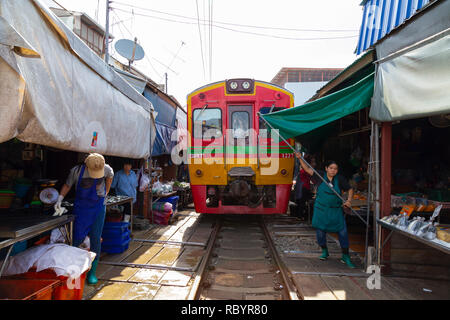 The Mae Klong Railway Market, or Bangkok Train Market, is a strange market just outside of Bangkok. Currently it is already a tourist attraction Stock Photo
