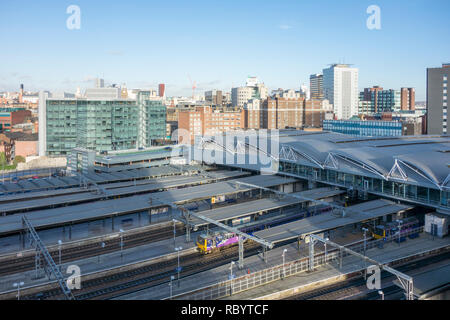 Leeds railway station and platforms viewed from above and city skyline, Leeds, West Yorkshire, UK Stock Photo
