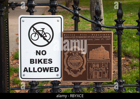 No Bikes Allowed sign and commemorative plaque for the Vendome Memorial, honoring 9 firefighters killed in the 1972 Hotel Vendome Fire, sculpted by Th Stock Photo